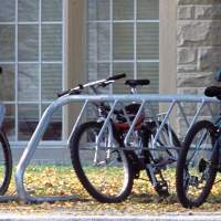 A bike rack at Western University is full of bicycles locked to the rack. 